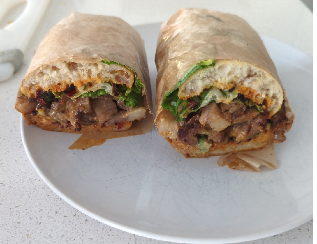 A picture of the Sichuan Brisket sandwich. I had to get one to write this blog post. You can't write a blog post about a sandwich and not have a picture of the sandwich. That is like, one of the 10 commandments or something. So I HAD to buy one and eat it